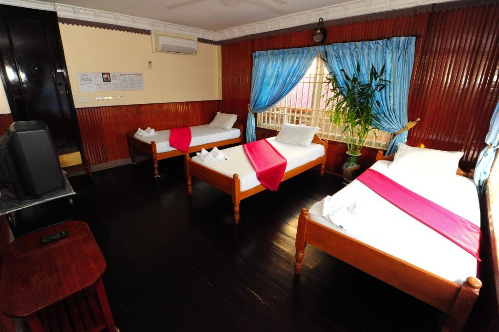 Okay Guesthouse Phnom Penh Zimmer foto