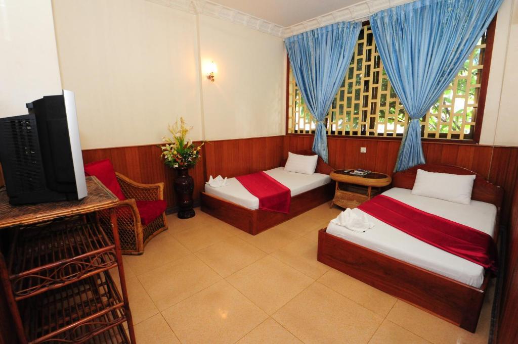 Okay Guesthouse Phnom Penh Zimmer foto
